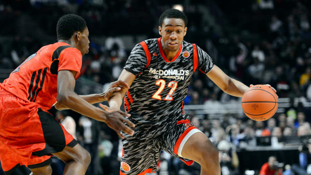 Apr 3, 2013; Chicago, IL, USA; McDonald's All American West forward Jabari Parker (22) dribbles the ball against McDonald's All American East forward Andrew Wiggins
